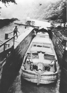 A freight boat traversing a lock